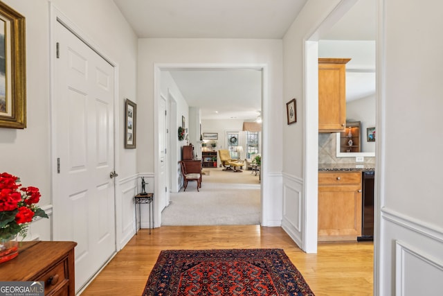 5105 Kings Common Way, Cumming, GA 30040 - hallway featuring light wood-style flooring and a wainscoted wall