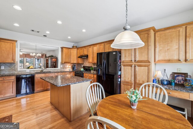 5105 Kings Common Way, Cumming, GA 30040 - kitchen with black appliances, a sink, under cabinet range hood, recessed lighting, and backsplash