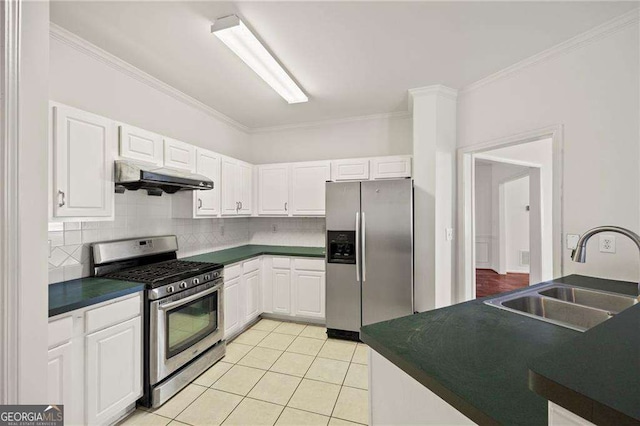2890 Winterhaven Ct, Atlanta, GA 30360 - kitchen featuring appliances with stainless steel finishes, a sink, under cabinet range hood, dark countertops, and backsplash