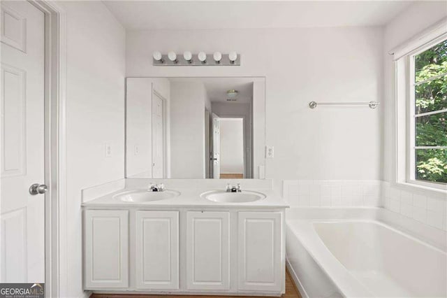 2890 Winterhaven Ct, Atlanta, GA 30360 - bathroom with a garden tub and double vanity