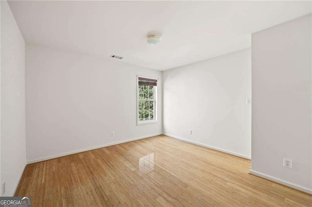 2890 Winterhaven Ct, Atlanta, GA 30360 - spare room featuring wood finished floors and baseboards