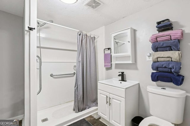2860 Jefferson St, Austell, GA 30106 - bathroom with vanity, a textured ceiling, and a shower stall