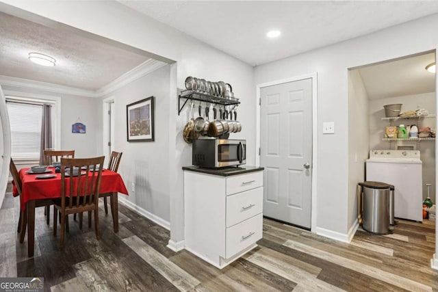 2860 Jefferson St, Austell, GA 30106 - dining room with wood finished floors, crown molding, and washer and dryer