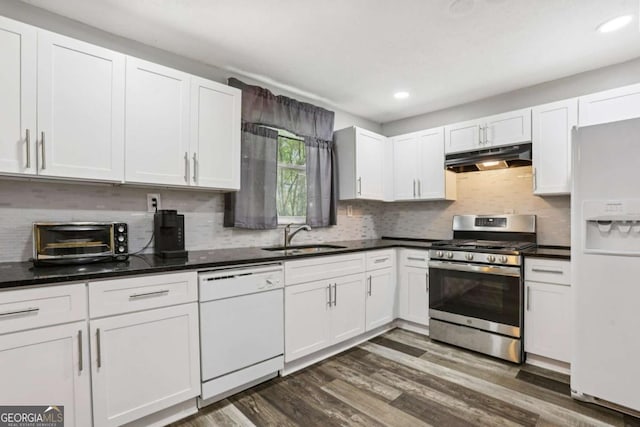 2860 Jefferson St, Austell, GA 30106 - kitchen with white appliances, under cabinet range hood, white cabinetry, tasteful backsplash, and recessed lighting