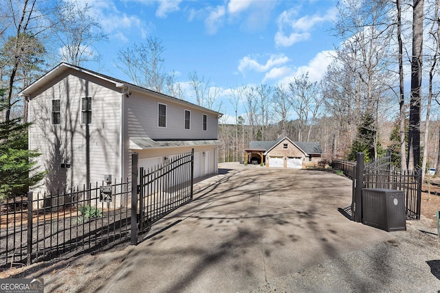 201 Hickory Hill Ln, Martin, GA 30557 - view of property exterior with concrete driveway, an attached garage, and a gate