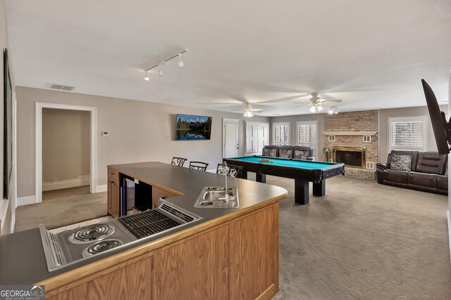 201 Hickory Hill Ln, Martin, GA 30557 - game room with light colored carpet, a sink, pool table, a fireplace, and a ceiling fan