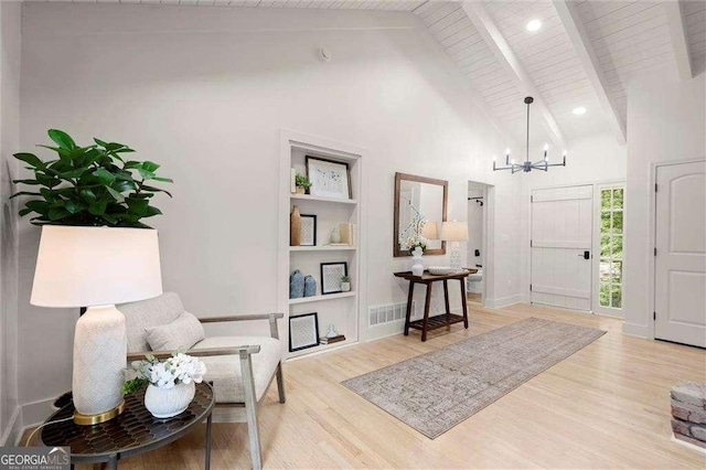 6405 Cherry Tree Ln, Atlanta, GA 30328 - foyer entrance with a chandelier, wood finished floors, high vaulted ceiling, and a wood ceiling with exposed beams
