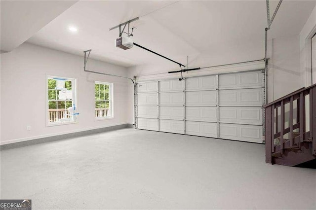6405 Cherry Tree Ln, Atlanta, GA 30328 - garage featuring a garage door opener and baseboards