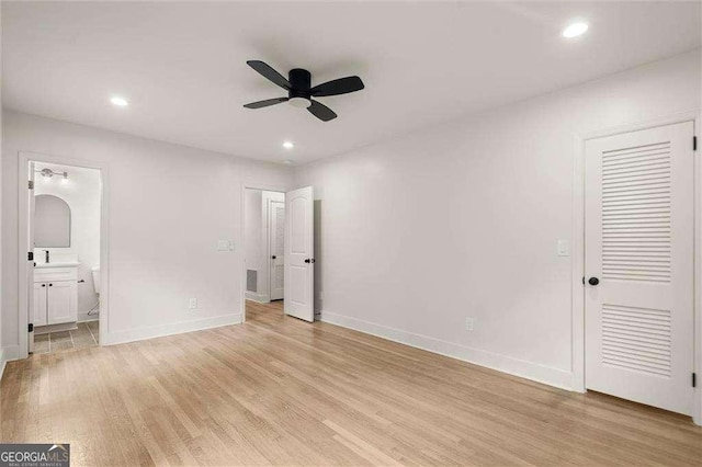 6405 Cherry Tree Ln, Atlanta, GA 30328 - unfurnished bedroom featuring light wood-type flooring, recessed lighting, and connected bathroom