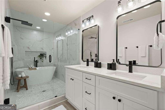 6405 Cherry Tree Ln, Atlanta, GA 30328 - full bath featuring a marble finish shower, a freestanding tub, double vanity, and recessed lighting