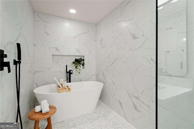6405 Cherry Tree Ln, Atlanta, GA 30328 - bathroom featuring tile walls, a soaking tub, recessed lighting, and a shower