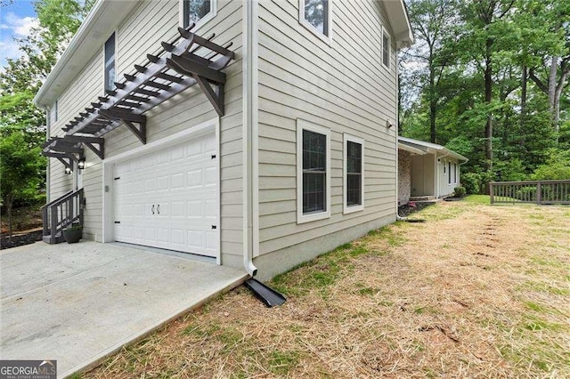 6405 Cherry Tree Ln, Atlanta, GA 30328 - view of side of home with a garage and concrete driveway