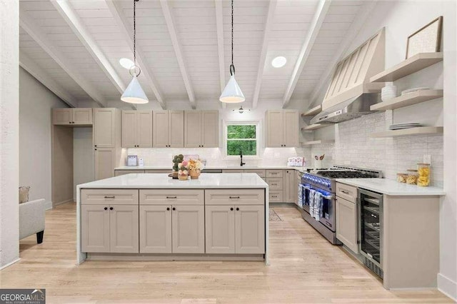 6405 Cherry Tree Ln, Atlanta, GA 30328 - kitchen featuring wine cooler, double oven range, open shelves, light countertops, and backsplash