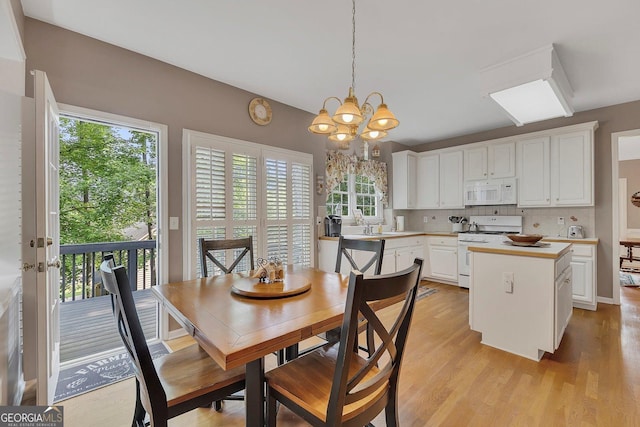 6302 Manassas Pass NW, Acworth, GA 30101 - dining room featuring plenty of natural light, a chandelier, and light wood-style flooring