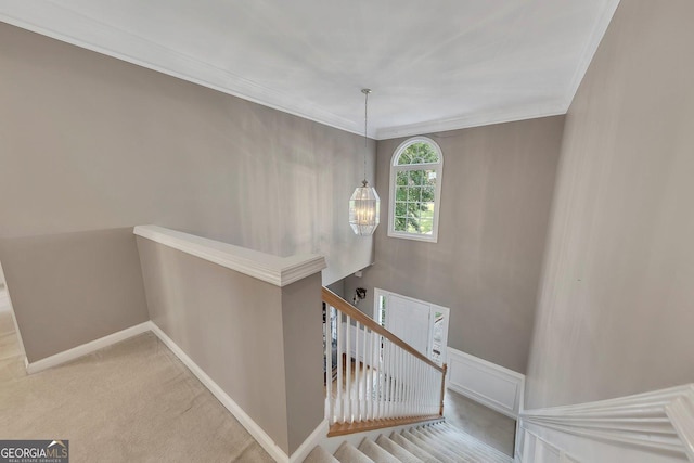 6302 Manassas Pass NW, Acworth, GA 30101 - stairway featuring carpet floors, crown molding, and a chandelier