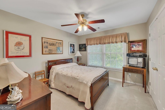 6302 Manassas Pass NW, Acworth, GA 30101 - bedroom featuring light colored carpet, ceiling fan, and a closet