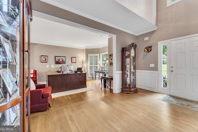 6302 Manassas Pass NW, Acworth, GA 30101 - foyer entrance featuring light wood finished floors, ornamental molding, and a wainscoted wall
