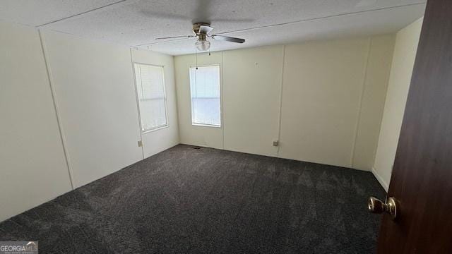 279 Baker Cir SE, Calhoun, GA 30701 - empty room featuring dark colored carpet and ceiling fan