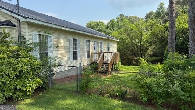 279 Baker Cir SE, Calhoun, GA 30701 - view of home's exterior with a deck