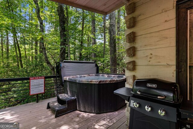 25 Hidden Ridge Ct, Cherry Log, GA 30522 - wooden deck with a hot tub and area for grilling
