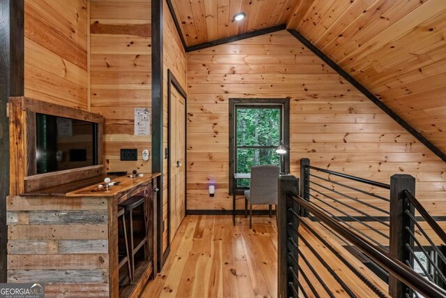 25 Hidden Ridge Ct, Cherry Log, GA 30522 - hallway featuring wood ceiling, wooden walls, vaulted ceiling, an upstairs landing, and light wood-style flooring