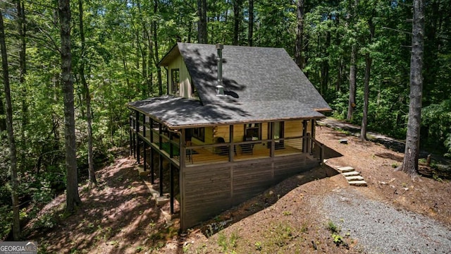 25 Hidden Ridge Ct, Cherry Log, GA 30522 - view of front facade featuring a shingled roof, a porch, and a wooded view