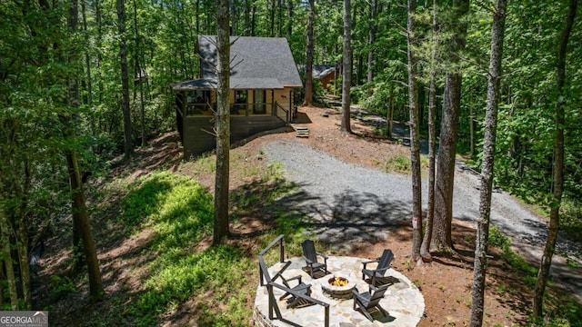 25 Hidden Ridge Ct, Cherry Log, GA 30522 - view of yard featuring an outdoor fire pit, a view of trees, and a porch