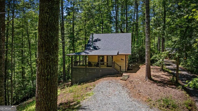 25 Hidden Ridge Ct, Cherry Log, GA 30522 - chalet / cabin featuring covered porch, driveway, a shingled roof, and a forest view