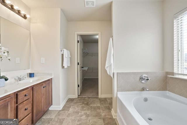 203 Creek View Ln, Acworth, GA 30102 - full bathroom with a garden tub, vanity, and a walk in closet