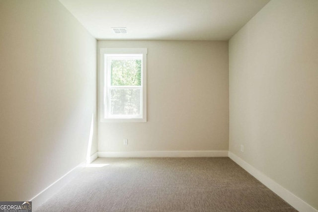 106 Henley St, Canton, GA 30114 - carpeted spare room featuring baseboards