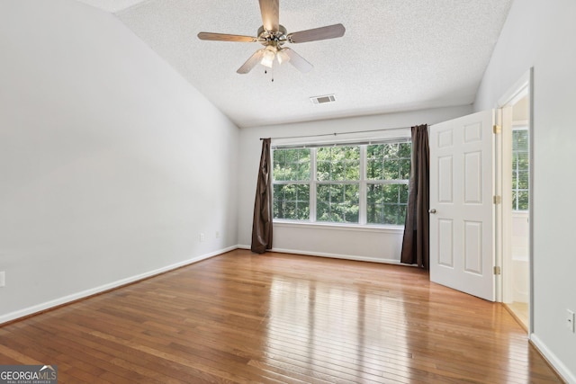 3850 Stepney Way, Cumming, GA 30041 - unfurnished room with a textured ceiling, wood-type flooring, vaulted ceiling, and a ceiling fan