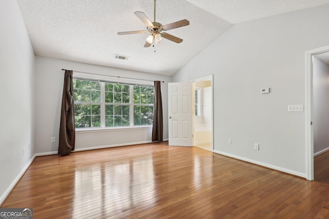 3850 Stepney Way, Cumming, GA 30041 - empty room featuring a ceiling fan, a textured ceiling, hardwood / wood-style floors, and lofted ceiling