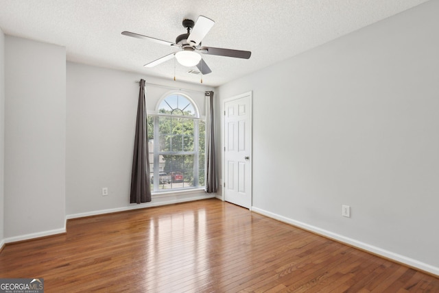3850 Stepney Way, Cumming, GA 30041 - spare room featuring hardwood / wood-style floors, a ceiling fan, and a textured ceiling