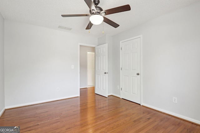 3850 Stepney Way, Cumming, GA 30041 - spare room with wood finished floors and a ceiling fan