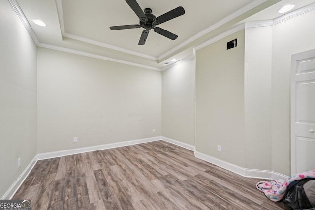 3850 Stepney Way, Cumming, GA 30041 - spare room featuring wood finished floors, a ceiling fan, ornamental molding, recessed lighting, and a raised ceiling