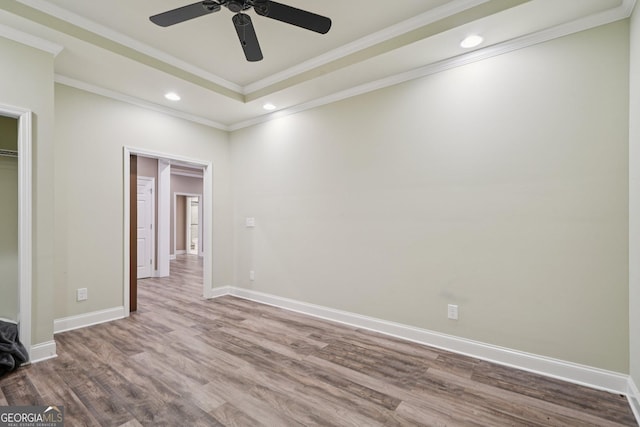 3850 Stepney Way, Cumming, GA 30041 - unfurnished bedroom with wood finished floors, recessed lighting, ornamental molding, a raised ceiling, and ceiling fan