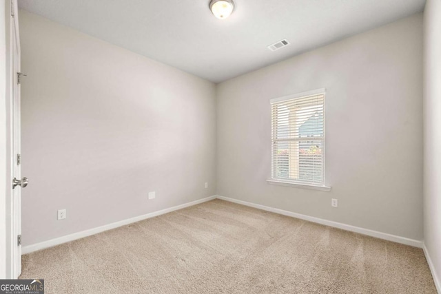 175 Orchard Ln, Covington, GA 30014 - unfurnished room featuring baseboards and light colored carpet