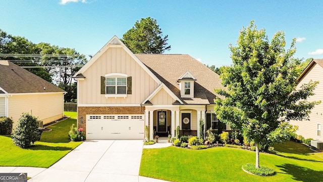 4557 Brayden Dr, Gainesville, GA 30504 - craftsman-style home with board and batten siding, brick siding, a front yard, concrete driveway, and an attached garage