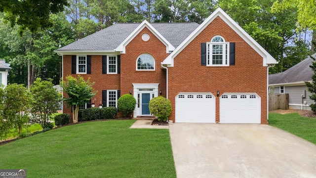 10865 Misty Moon Ct, Alpharetta, GA 30022 - colonial home with concrete driveway, an attached garage, brick siding, and a shingled roof