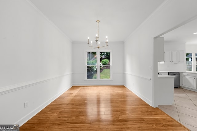 10865 Misty Moon Ct, Alpharetta, GA 30022 - unfurnished dining area featuring a chandelier, crown molding, light wood finished floors, and baseboards