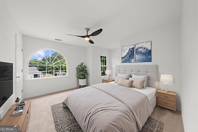 10865 Misty Moon Ct, Alpharetta, GA 30022 - bedroom featuring light carpet and a ceiling fan