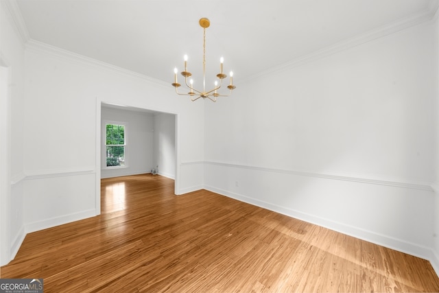 10865 Misty Moon Ct, Alpharetta, GA 30022 - empty room featuring a chandelier, light wood-type flooring, ornamental molding, and baseboards
