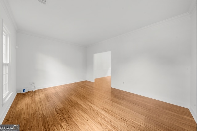 10865 Misty Moon Ct, Alpharetta, GA 30022 - unfurnished room with light wood-style floors and ornamental molding