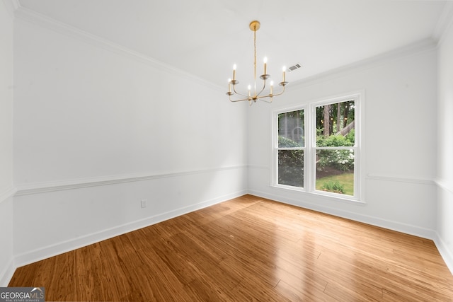 10865 Misty Moon Ct, Alpharetta, GA 30022 - empty room featuring a chandelier, ornamental molding, and wood finished floors