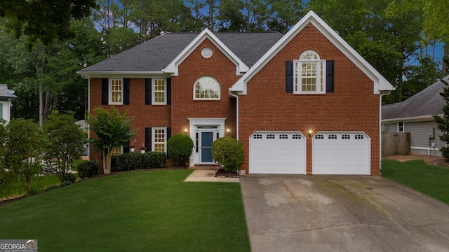 10865 Misty Moon Ct, Alpharetta, GA 30022 - view of front of home with an attached garage, driveway, and brick siding