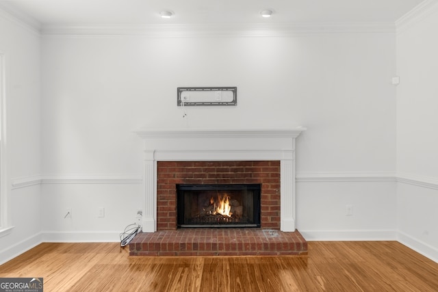 10865 Misty Moon Ct, Alpharetta, GA 30022 - detailed view of wood finished floors, a brick fireplace, ornamental molding, and baseboards