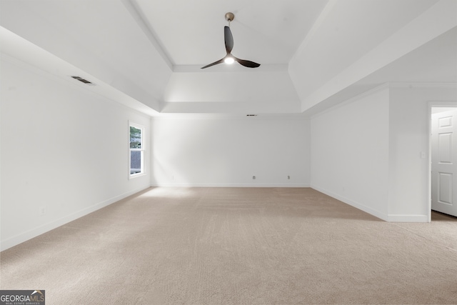 10865 Misty Moon Ct, Alpharetta, GA 30022 - empty room featuring a tray ceiling, ceiling fan, light colored carpet, and baseboards