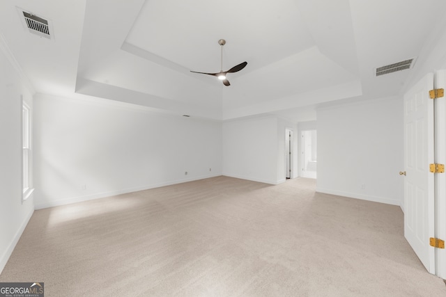 10865 Misty Moon Ct, Alpharetta, GA 30022 - empty room featuring a tray ceiling, ceiling fan, and light colored carpet