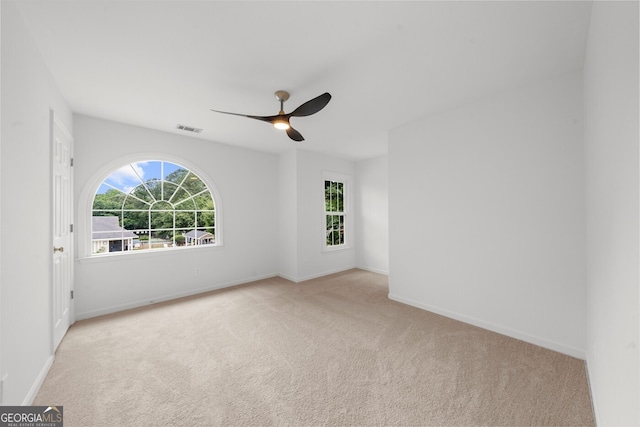 10865 Misty Moon Ct, Alpharetta, GA 30022 - spare room featuring carpet flooring, ceiling fan, and baseboards