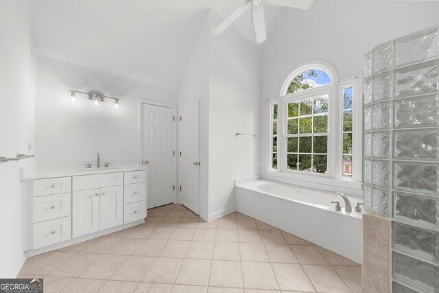 10865 Misty Moon Ct, Alpharetta, GA 30022 - bathroom with a bath, tile patterned floors, vanity, high vaulted ceiling, and a ceiling fan